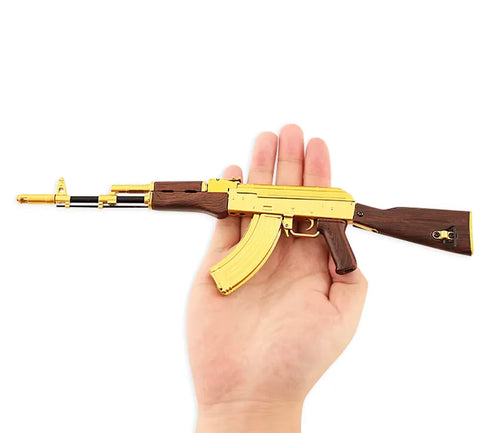 AK 47 Gold 1:3 scale miniature rifle side view with gold receiver, wood stock, magazine and barrel by M1 Mini Guns, non‑firing replica