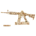 AR‑15 Desert Camo 1:3 scale miniature rifle with sand‑tone camouflage finish, adjustable stock, accessory rails, removable suppressor, and display stand by M1 Mini Guns, non‑firing replica